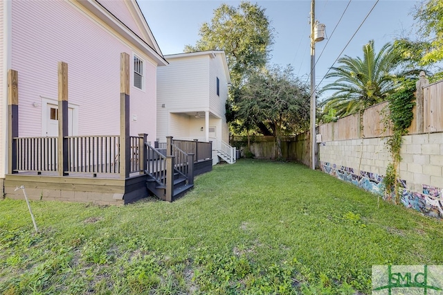 view of yard with a wooden deck