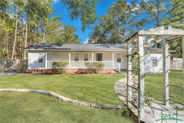 single story home with a front lawn and covered porch