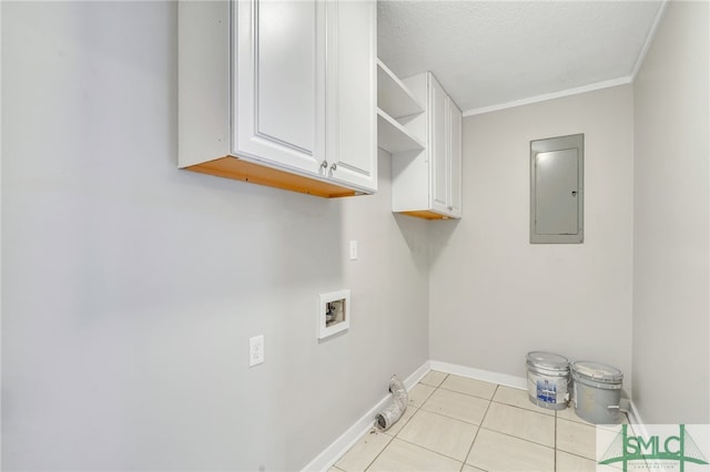 clothes washing area featuring cabinets, electric panel, washer hookup, a textured ceiling, and light tile patterned flooring