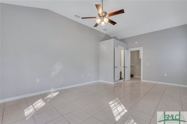 unfurnished room with ceiling fan, light tile patterned flooring, and lofted ceiling