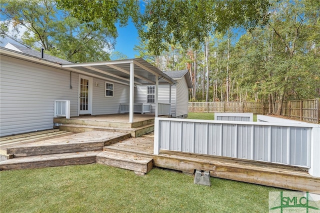 wooden deck with a yard