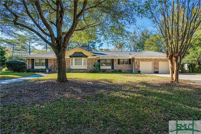 ranch-style house featuring a garage and a front yard