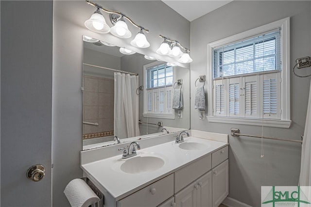 bathroom with vanity and curtained shower