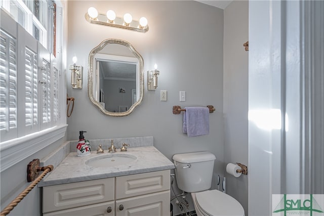 bathroom with vanity and toilet