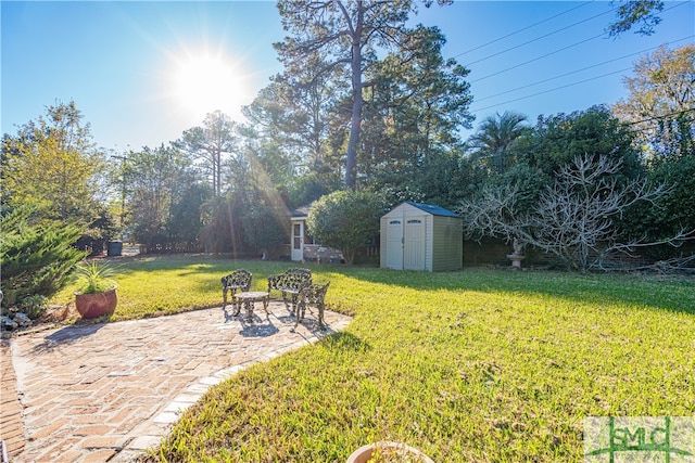 view of yard featuring a patio area and a storage shed