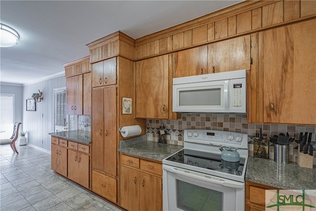 kitchen with white appliances, crown molding, and tasteful backsplash