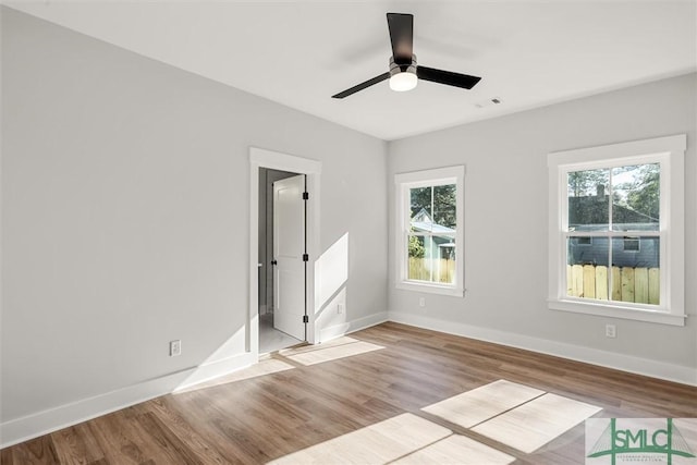 spare room with ceiling fan and light hardwood / wood-style flooring