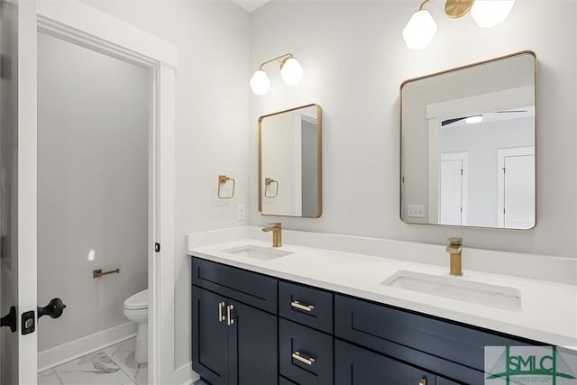 bathroom featuring vanity and toilet