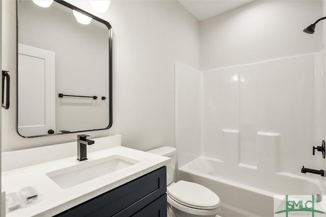 full bathroom featuring shower / washtub combination, vanity, and toilet