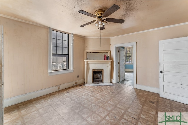 unfurnished living room featuring a fireplace, a textured ceiling, ceiling fan, and ornamental molding