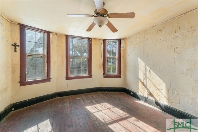 unfurnished room with hardwood / wood-style floors and ceiling fan