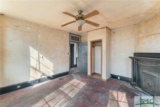 unfurnished living room with a fireplace and ceiling fan