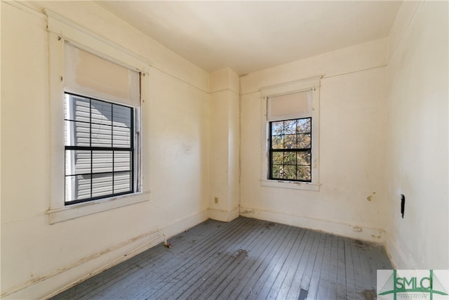 unfurnished room featuring hardwood / wood-style flooring