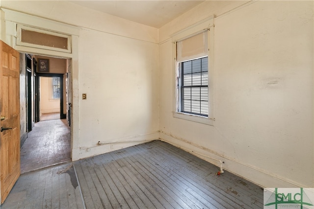 spare room with hardwood / wood-style flooring