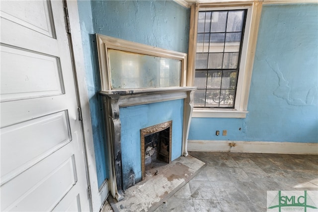 unfurnished living room featuring a fireplace