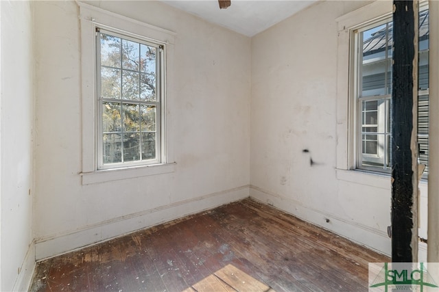 spare room featuring dark hardwood / wood-style flooring