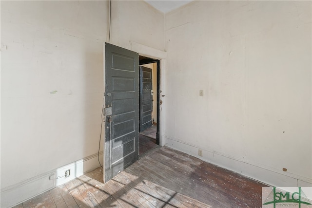 spare room featuring hardwood / wood-style floors