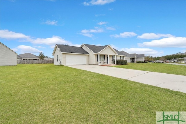 ranch-style home with a garage, covered porch, and a front yard