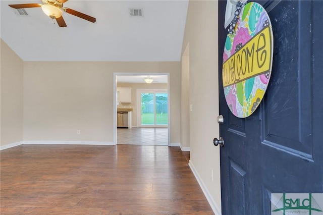 entryway with hardwood / wood-style flooring, vaulted ceiling, and ceiling fan