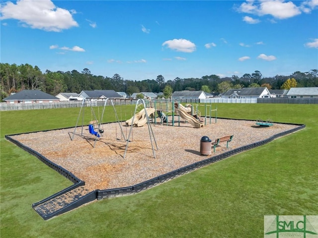 view of playground with a lawn