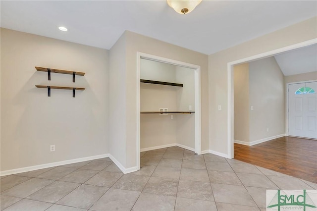 interior space with a closet and light hardwood / wood-style flooring