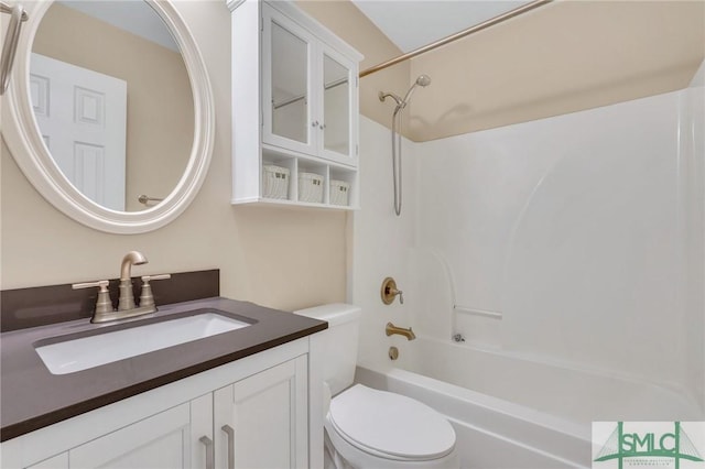 full bathroom featuring shower / washtub combination, vanity, and toilet