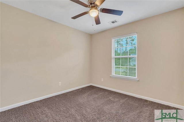 unfurnished room with carpet flooring and ceiling fan