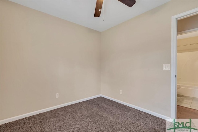 spare room featuring carpet floors and ceiling fan