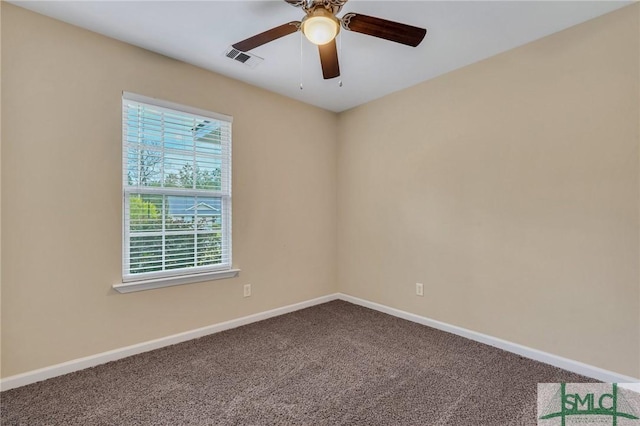 spare room featuring carpet flooring and ceiling fan