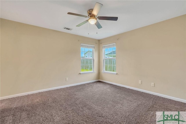 carpeted empty room featuring ceiling fan