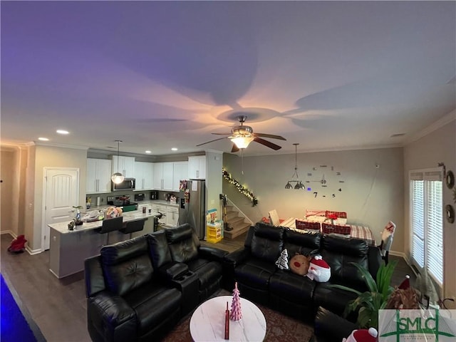 living room with ceiling fan, dark wood-type flooring, and ornamental molding