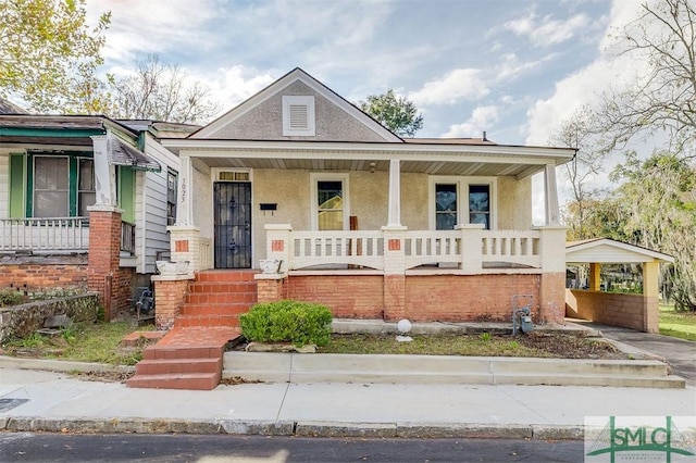 view of front of property featuring covered porch