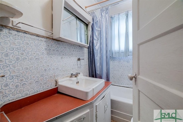 bathroom with shower / bath combo and vanity