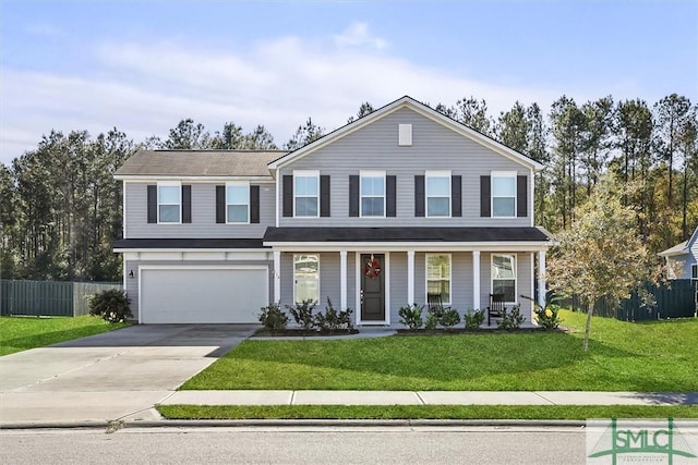 view of front of house with a garage and a front lawn