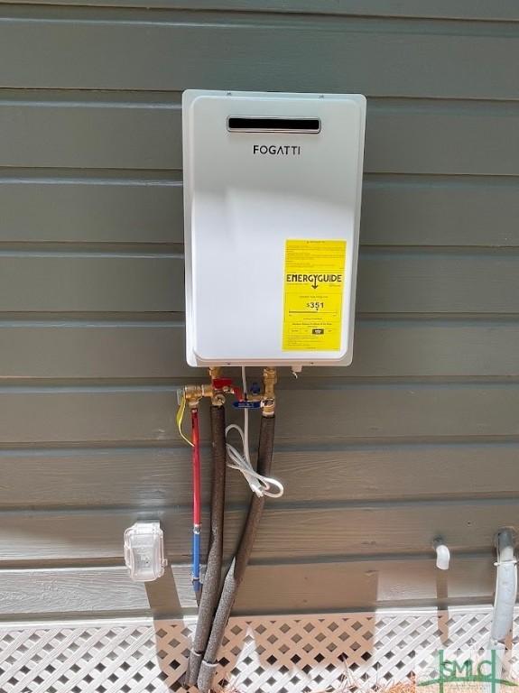 exterior details featuring tankless water heater