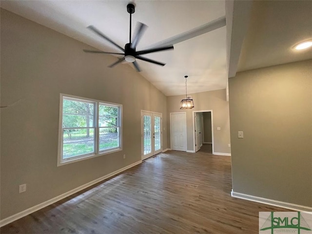 interior space with french doors, dark hardwood / wood-style flooring, high vaulted ceiling, and ceiling fan with notable chandelier