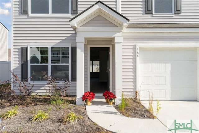 doorway to property featuring a garage