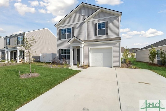 view of front of house with a front yard and a garage