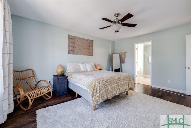 bedroom featuring ensuite bath, ceiling fan, and dark hardwood / wood-style floors