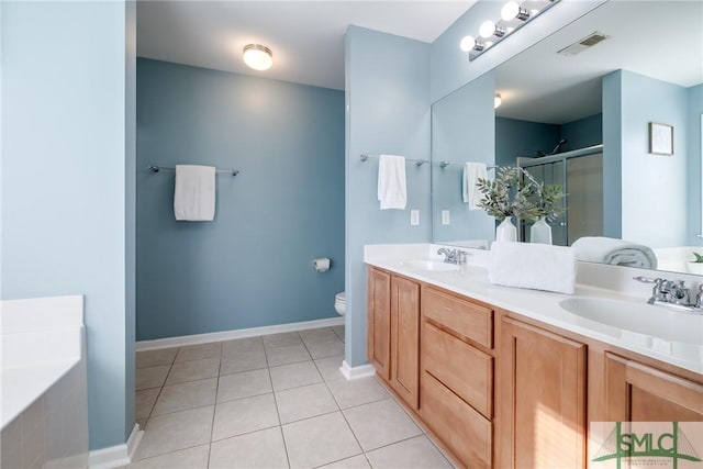 full bathroom with tile patterned floors, vanity, toilet, and shower with separate bathtub