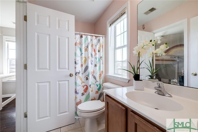 bathroom with hardwood / wood-style flooring, vanity, curtained shower, and toilet