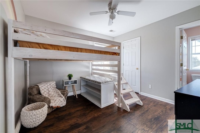 bedroom with ceiling fan and dark hardwood / wood-style flooring