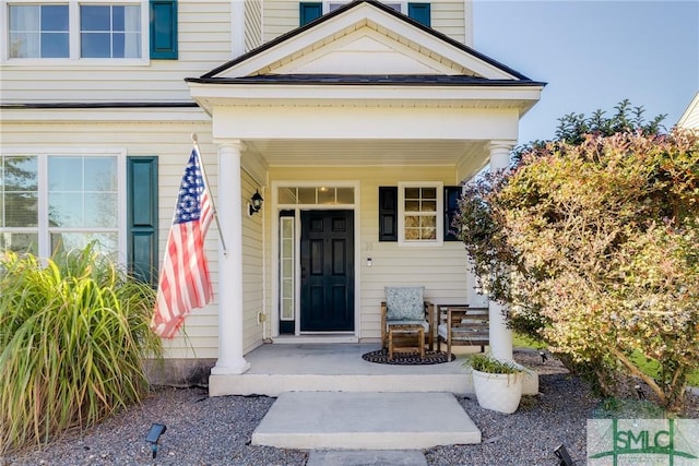 property entrance featuring covered porch