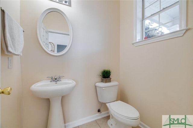 bathroom with tile patterned flooring and toilet