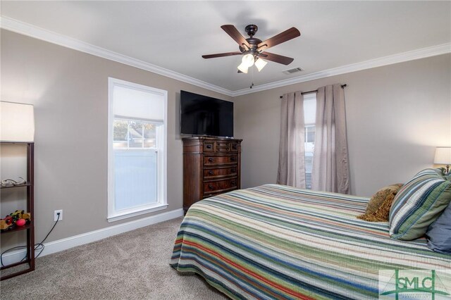 bedroom featuring ceiling fan, ornamental molding, and light carpet