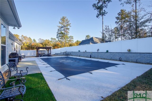 view of swimming pool featuring a pergola and a patio area