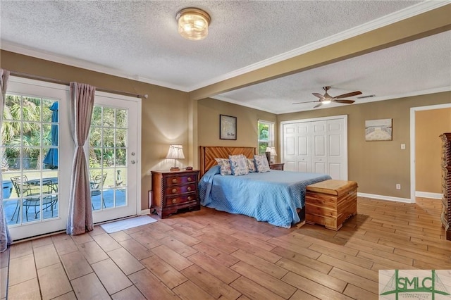 bedroom with access to exterior, multiple windows, a closet, and ceiling fan