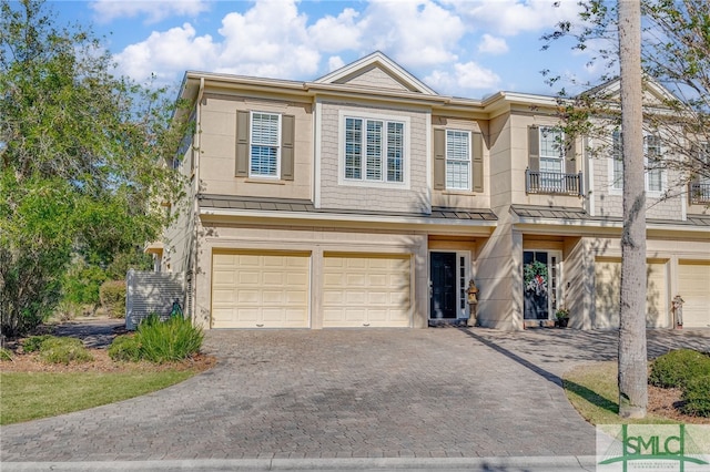 townhome / multi-family property featuring a garage