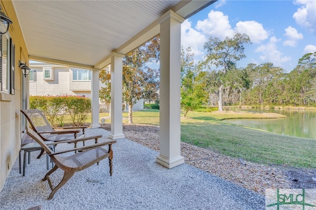 view of patio / terrace featuring a water view