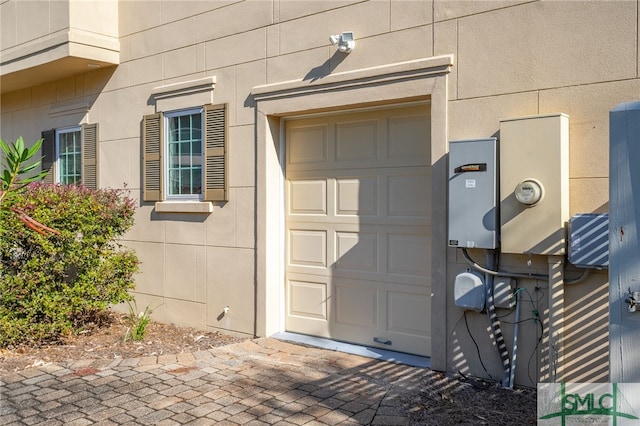 doorway to property featuring a garage